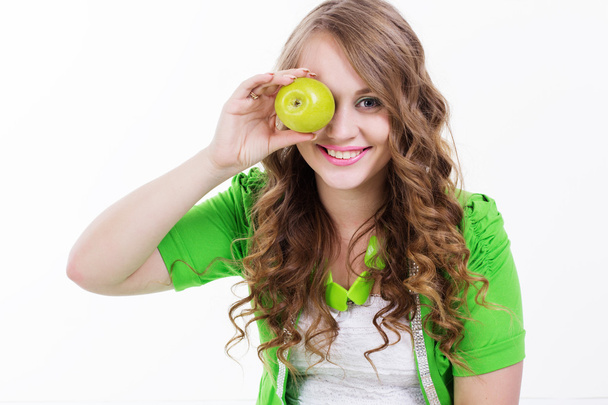 緑のリンゴと微笑んでいる女の子健康食品 - 写真・画像
