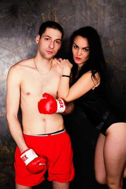 Young beautiful couple of brunette woman and handsome boxer man - 写真・画像