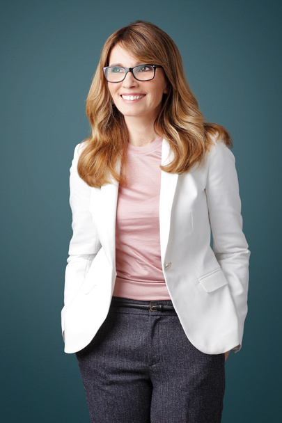 smiling executive businesswoman standing - Фото, изображение
