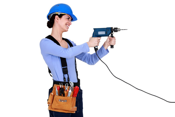 Construction worker holding screwdriver - Фото, зображення