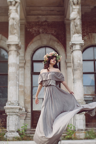 Beautiful woman with a flower wreath on the head. - Fotó, kép