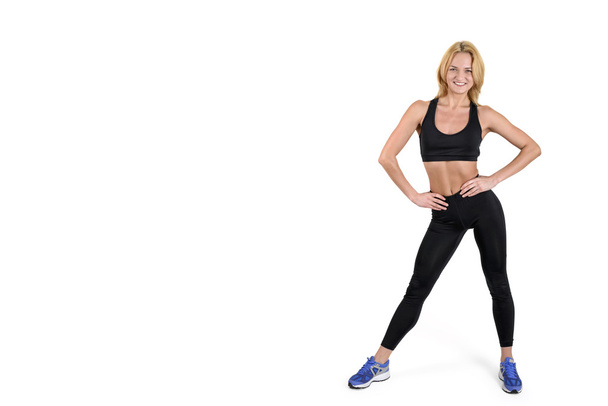Beautiful smiling fitness woman isolated on white background - Photo, image