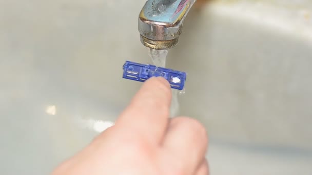 To wash away foam a water stream in a sink - Footage, Video