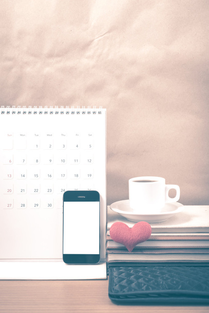 office desk : coffee with phone,wallet,calendar,heart,stack of b - Photo, image