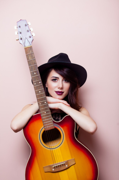 portrait of a young beautiful woman with guitar - Photo, Image