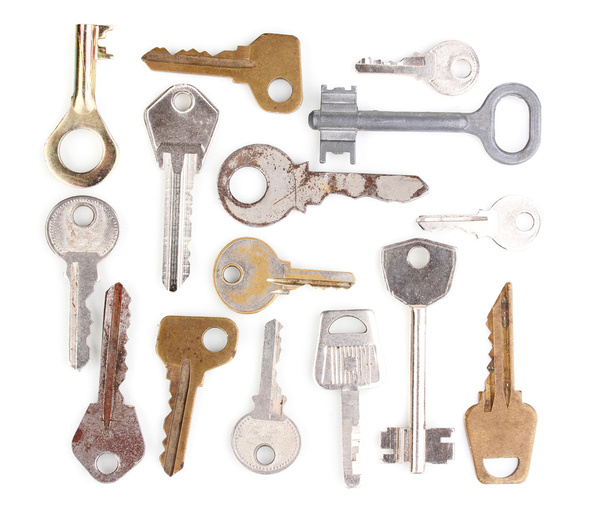 Many metal keys isolated on white - Фото, изображение
