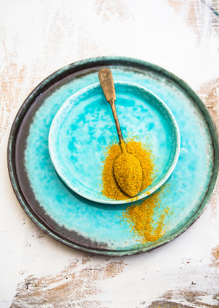 Yellow curry on vintage spoon - Fotoğraf, Görsel