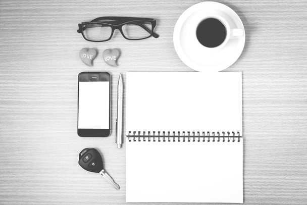 office desk : coffee and phone with car key,eyeglasses,notepad,h - Foto, Imagen