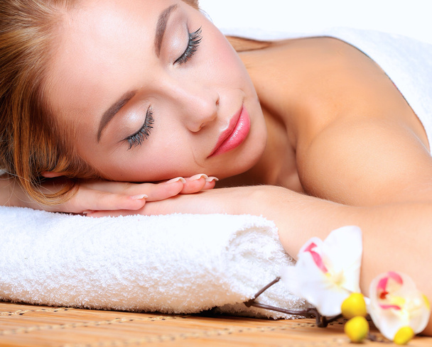 Closeup of an attractive young woman receiving massage - Zdjęcie, obraz