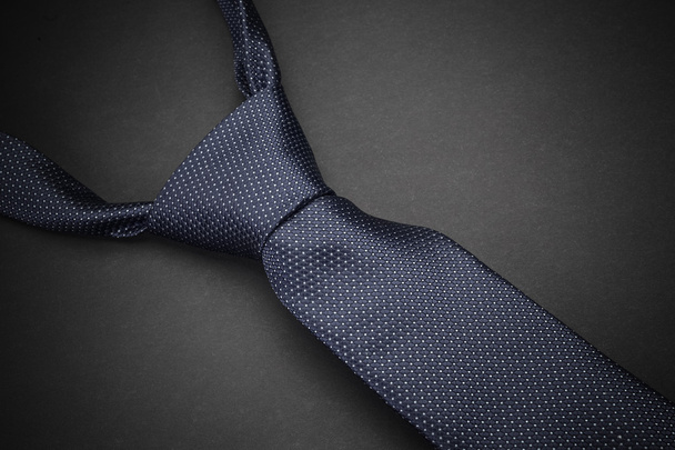 Elegant  blue tie on dark background - 写真・画像