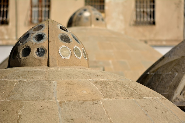 Round ancient roofs of public baths in Baku Old City, within the capital of Azerbaijan - Photo, Image