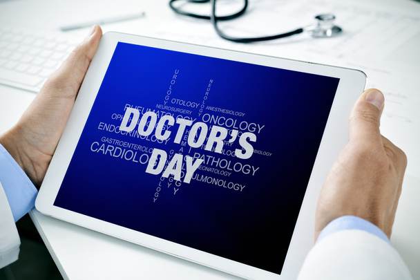 doctor with a tablet with the text doctors day - Photo, Image