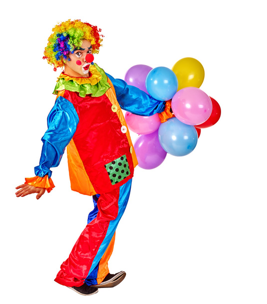 Happy birthday clown holding  bunch of balloons. - Foto, Bild