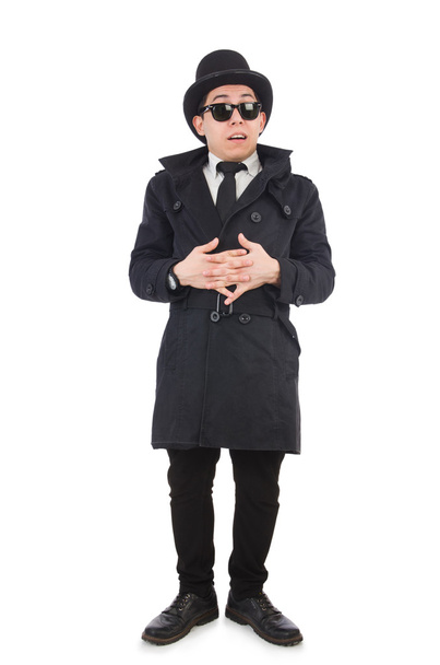 Young detective in black coat isolated on white - Fotoğraf, Görsel