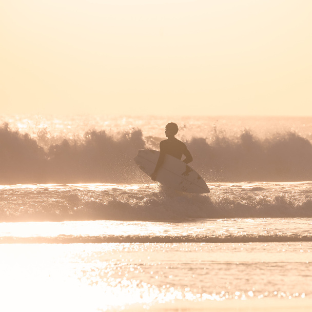 Surfers on beach with surfboard. - Photo, Image