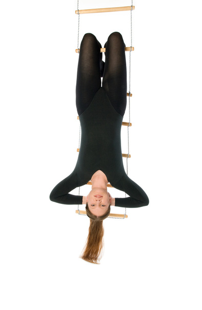 Woman hanging on a rope ladder - Foto, Imagem
