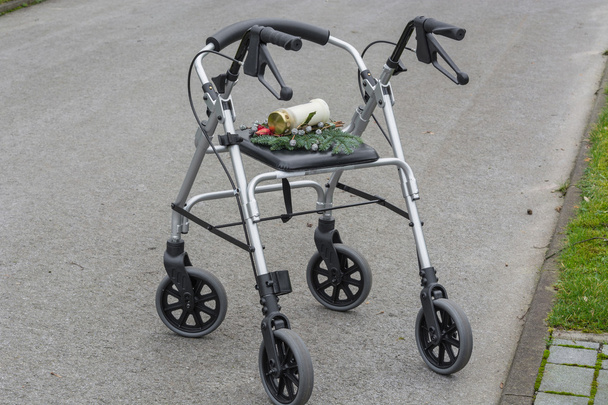 Rollator walker with grave candle     - Photo, Image