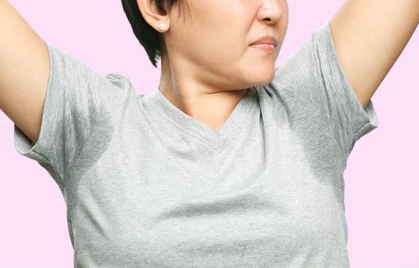 woman with sweating very badly under armpit - Photo, Image