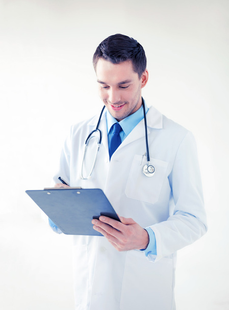 male doctor writing prescription - Фото, зображення
