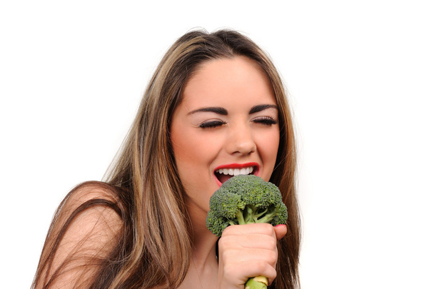 Portret van mooi meisje met groene broccolli - Foto, afbeelding