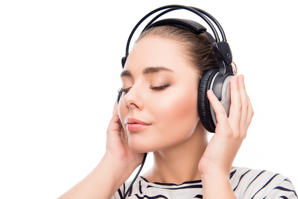 Relaxed calm girl listening music in headphones with closed eyes - Foto, imagen