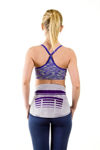 Woman Wearing Lower Back Support Brace - 写真・画像