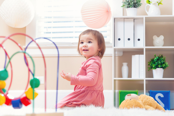 Happy toddler girl playing with toys - Foto, Imagem