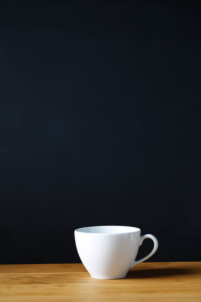 Coffee cup on wooden table  - 写真・画像