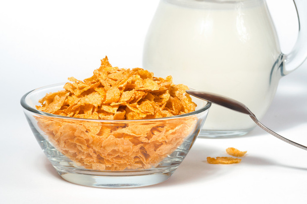 Terveellinen aamiainen maissihiutaleet maitoa
 - Valokuva, kuva
