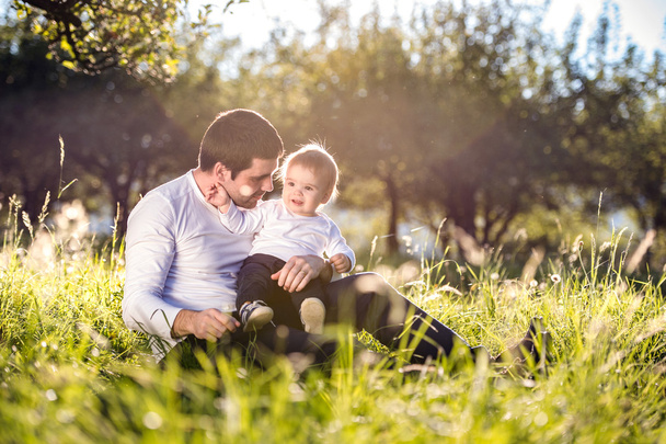 Parents with little son on grass - Fotoğraf, Görsel