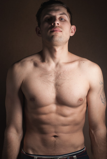 muscular guy without a shirt - Fotoğraf, Görsel