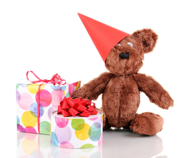 Sitting bear toy with gifts isolated on white - Foto, afbeelding