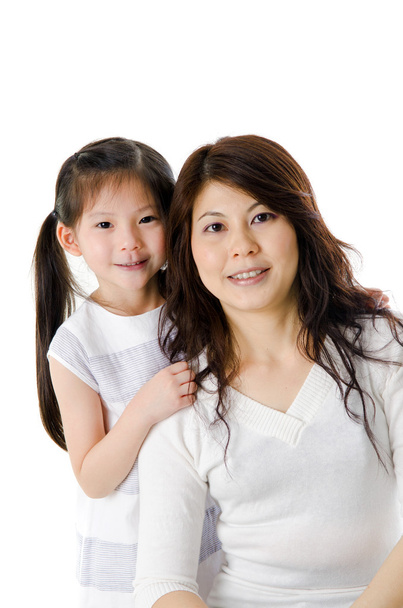Asian mother and her daughter on white background - Foto, imagen