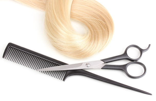 Shiny blond hair with hair cutting shears and comb isolated on white - 写真・画像