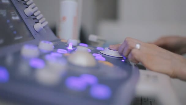 Medical doctor making ultrasound with modern equipment - Felvétel, videó