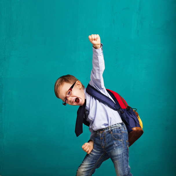 smiling little boy with big backpack jumping and having fun - Photo, Image