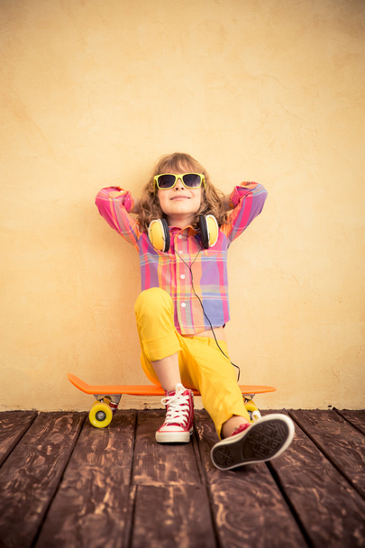 Hipster child with skateboard - Φωτογραφία, εικόνα