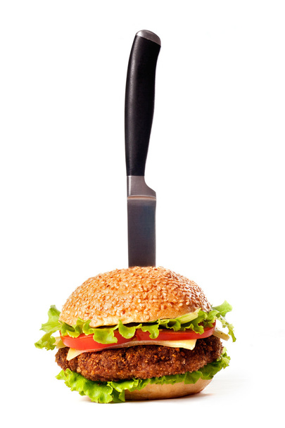Hamburger pinned with knife - Zdjęcie, obraz