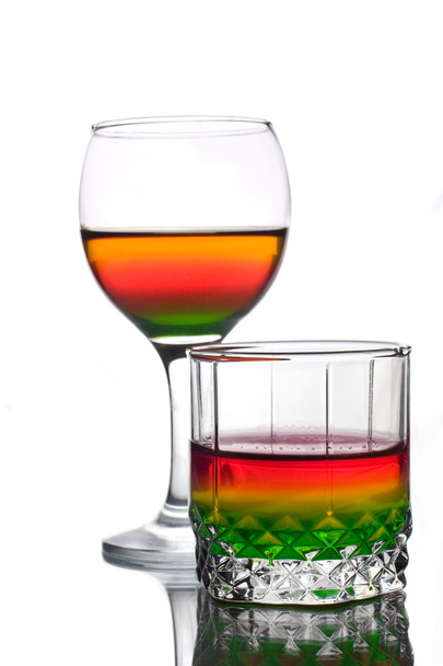 Served multicolored alcohol drinks - 写真・画像
