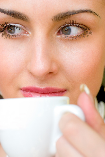 Beautiful woman drinking coffee - Фото, изображение