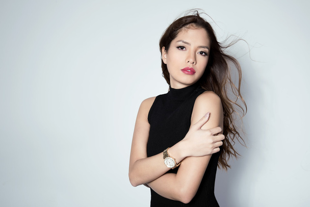 beautiful young asian woman wearing a wrist watch - Foto, immagini