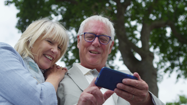 couple looking at mobile phone - Video