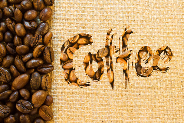Inscription coffee lined wuth coffee beans  - Фото, изображение