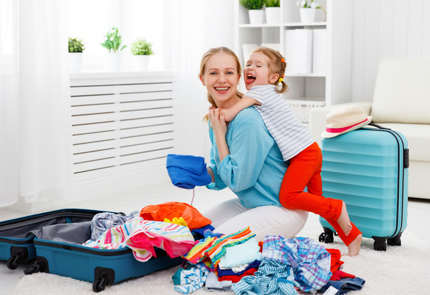 happy family mother and child daughter suitcases packed for vaca - Foto, Imagem