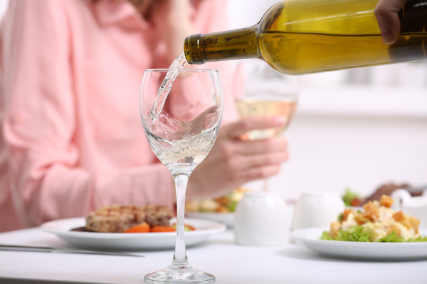Dinner with wine in restaurant - Foto, afbeelding
