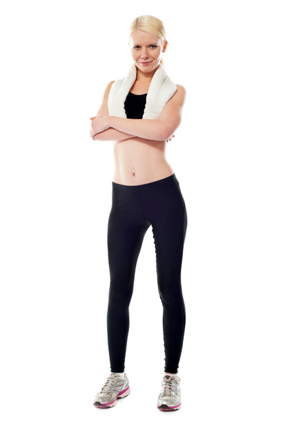 Smiling sports woman standing with folded arms - Photo, Image