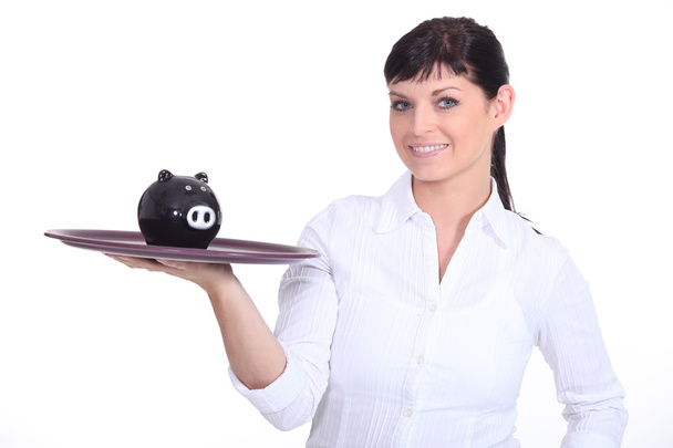 Waitress holding piggy bank - Foto, Bild