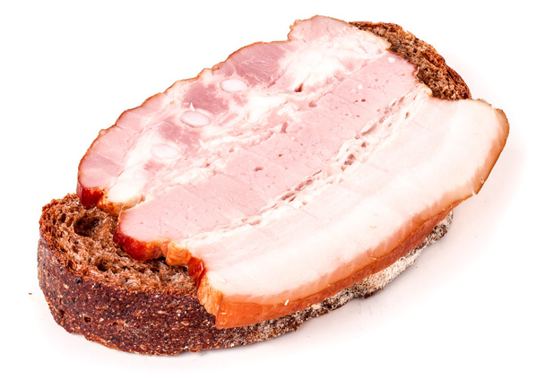 Sandwich con tocino rayado de jamón sobre fondo blanco
 - Foto, imagen