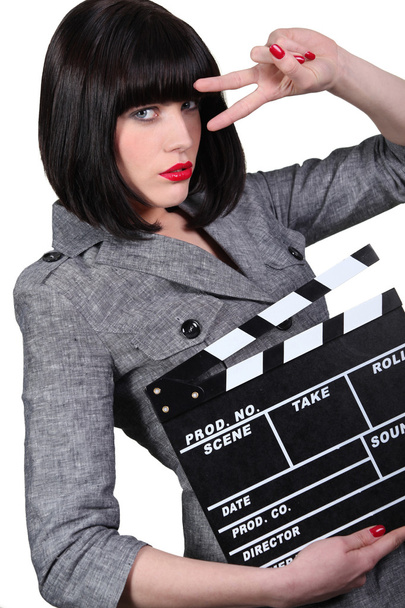 Take two: Girl with a film clapperboard - Φωτογραφία, εικόνα