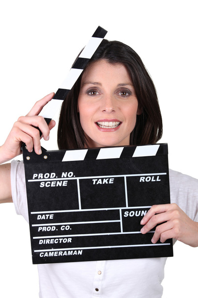 Brunette woman with movie slate - Foto, Imagem